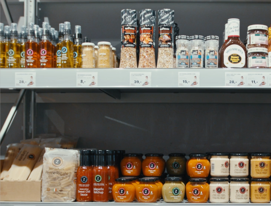 alt="Spices and sauces on the shelves in one of Basic & More's stores"